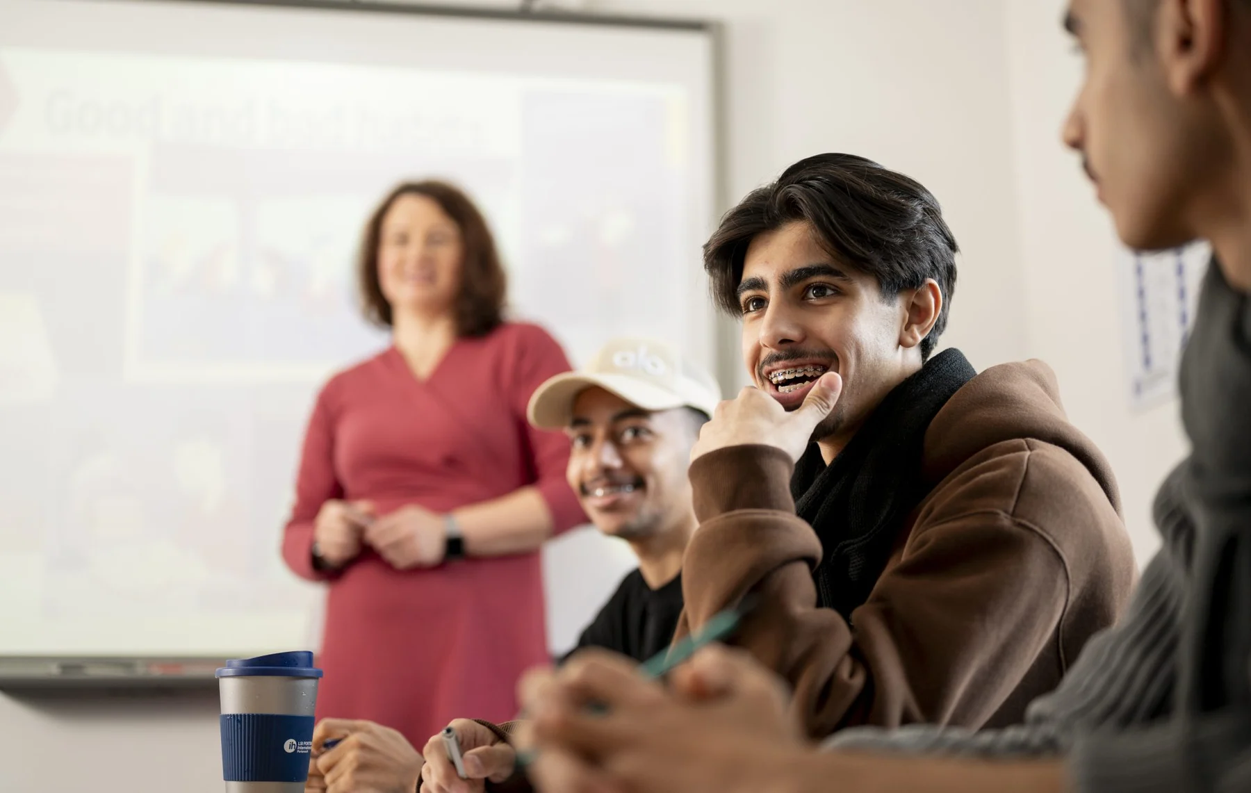 Teacher and students in an English classroom at LSI Portsmouth, as featured by Sterna Language